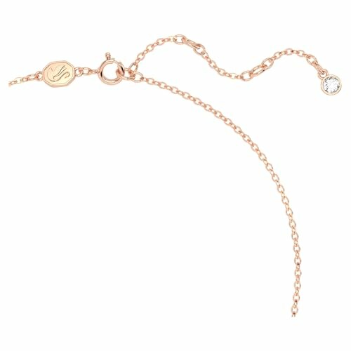 Bracelet en or rose avec breloque diamant.